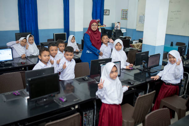 istock Take a picture after studying in the computer lab 1410479365