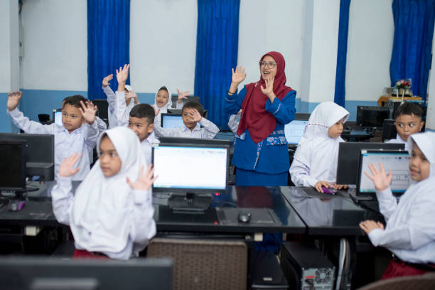 istock Take a picture after studying in the computer lab 1410479382