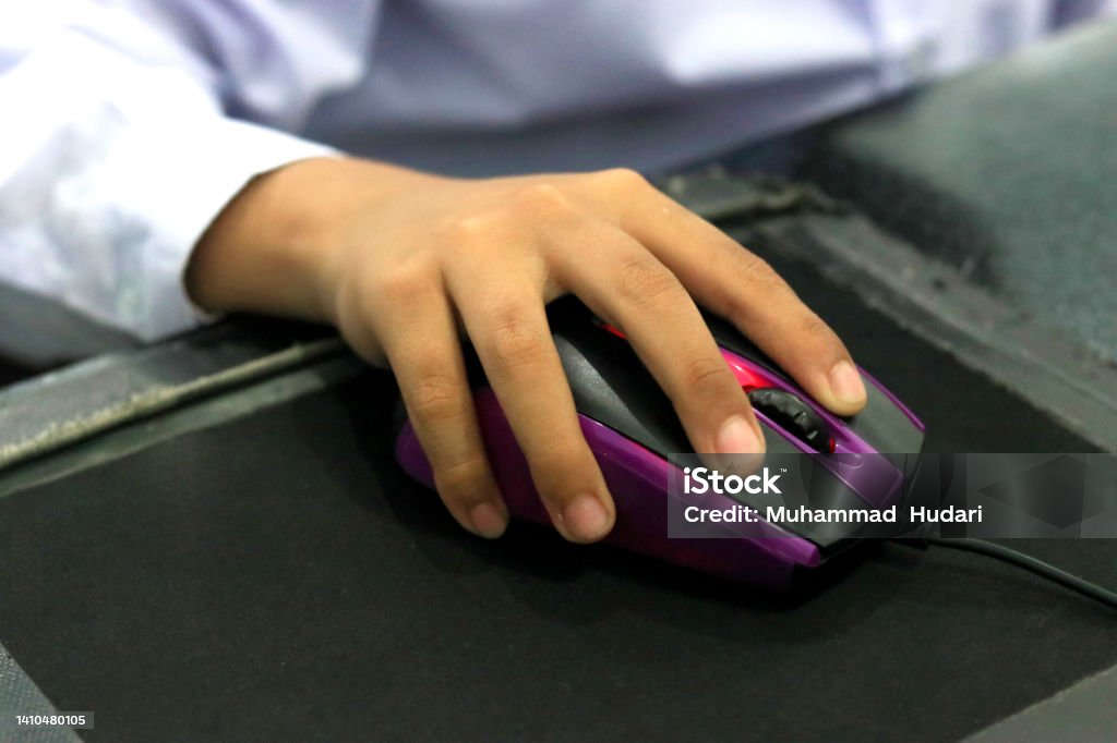 Using The Mouse While Studying Computer Stock Photo - Download Image ...