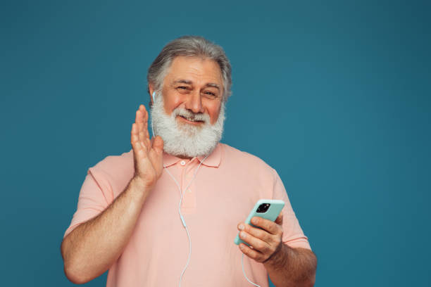 istock Portrait of emotional old man using smart phone 1410482461