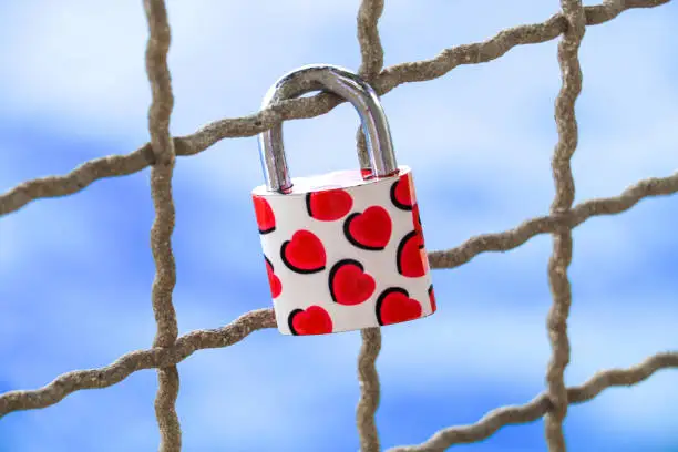 Love padlock with small red hearts