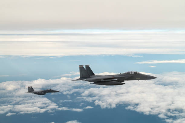 istock Jet aircrafts flying over the clouds. 1410485850