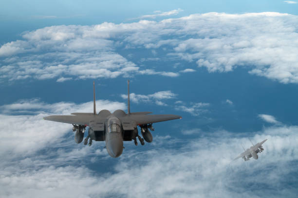 istock Jet aircrafts flying over the clouds. 1410486197