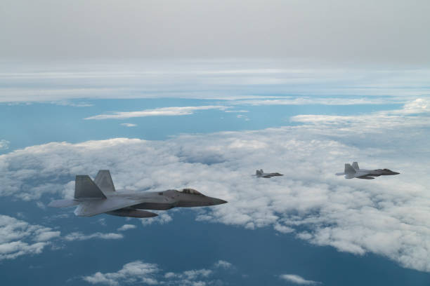 istock Jet aircrafts flying over the clouds. 1410487105