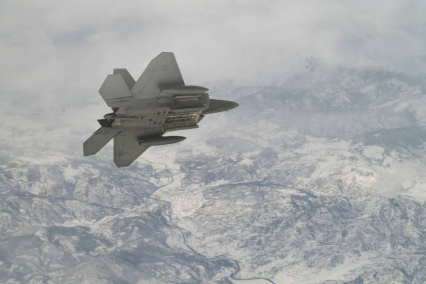 istock Jet aircrafts flying over snowcapped mountains. 1410488528