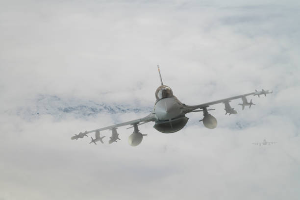 istock Jet aircrafts flying over snowcapped mountains. 1410489742