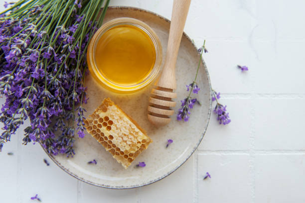 istock Jar with honey and fresh lavender flowers 1410490957