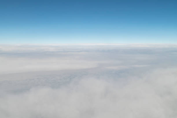 Above Clouds Clouds above the stratosphere from airplane window. stratosphere airplane cloudscape mountain stock pictures, royalty-free photos & images