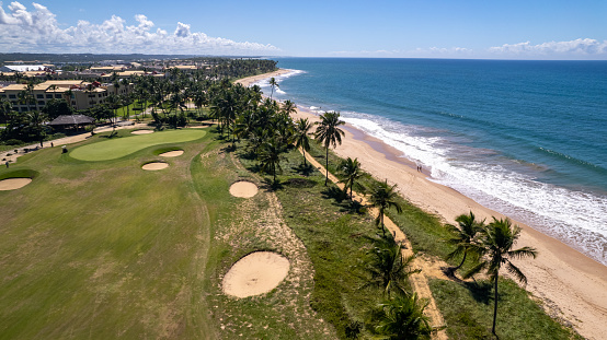 Praia do Forte - Mata de São João Salvador Bahia with a golf course next to it. A beautiful beach, very well cared for by a resort, offers a lot of attraction for all types of audiences, its large expanse of sand is great for walking and enjoying the beach every day of the week.