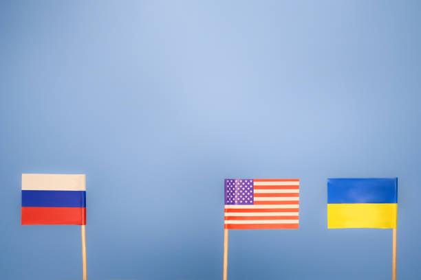 istock Ukrainian Russian and USA flags 1410497390