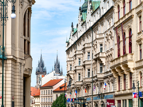Prague, Czech Republic - June 2022: Beautiful gothic architecture in the center of Prague and the towers of Church of Our Lady before Týn in the background