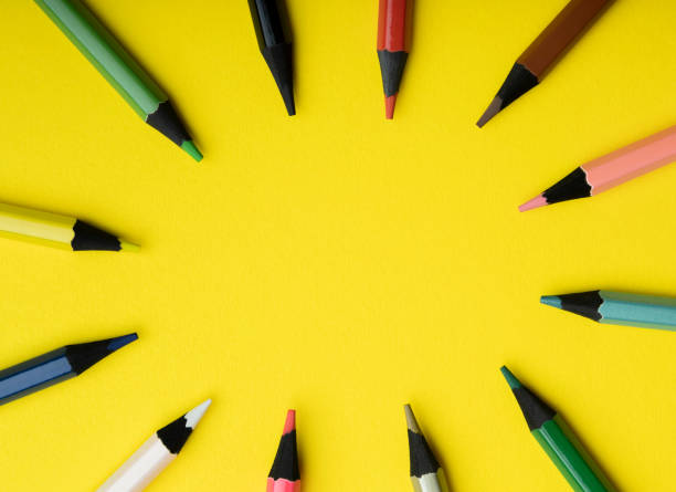 istock colored pencils on a yellow background 1410499970