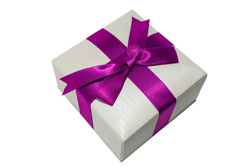Gift box with purple ribbon isolated on white background. Small Jewelry/holiday box macro