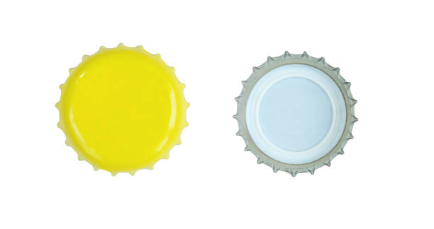 istock Two sides of yellow metallic bottle cap isolated on white background. 1410501106