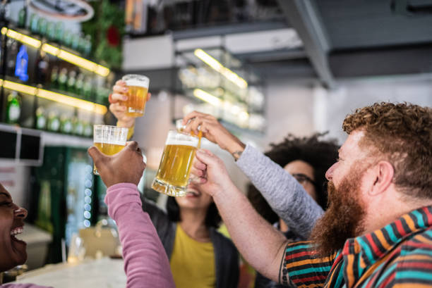 istock Friends toasting at a bar 1410505195