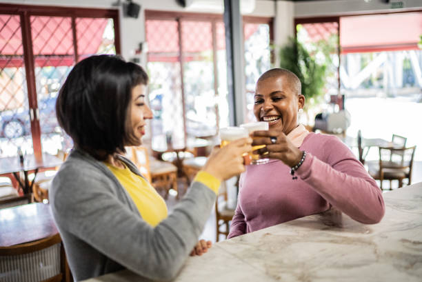 istock Friends toasting at a bar 1410505209