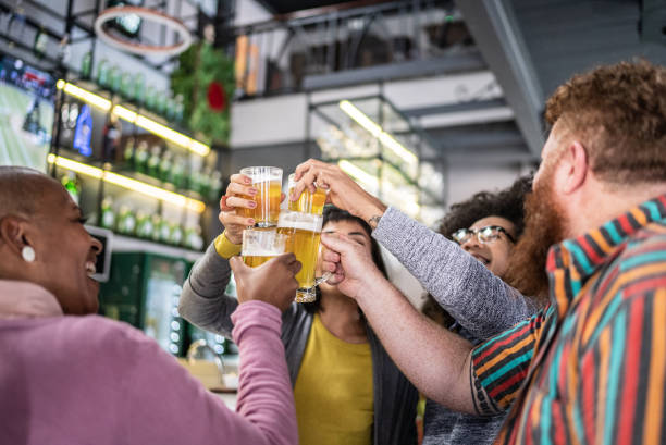 istock Friends toasting at a bar 1410505252