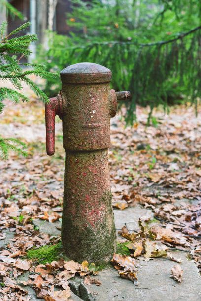 Old rusty abandoned hydrant out of order in the street of Caracas city,Venezuela.