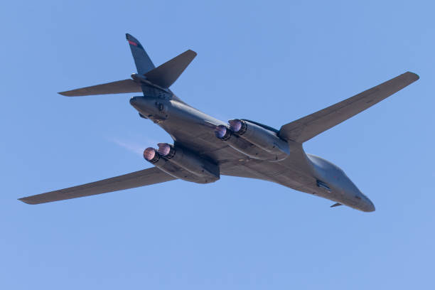 Close tail view of a B-1 Lancer bomber  with afterburners on Close tail view of a B-1 Lancer bomber  with afterburners on b1 bomber stock pictures, royalty-free photos & images
