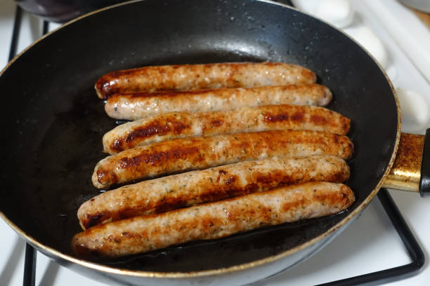 istock Fried chipolata in a frying pan 1410508376