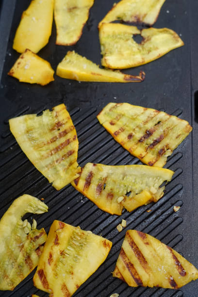 istock Sliced yellow zucchini being cooked on the barbecue 1410508403