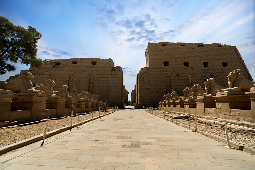 The first pylon, the façade of the Amun Re precinct with avenue of the sphinxes and the entrance of Karnak temple at Luxor . Egypt .