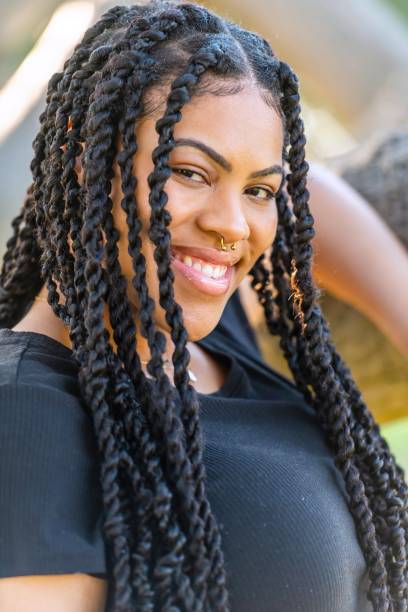 istock Smiling afro-latinx young woman looking at the camera 1410509409