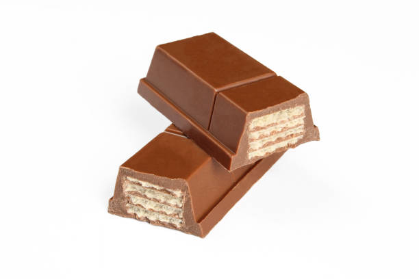 Chocolate covered wafer sweets. Two pieces of choco bar isolated on white background