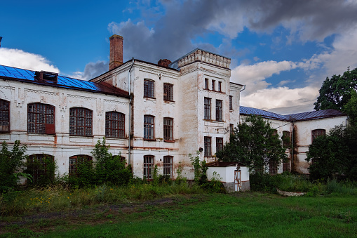 Ruined overgrown Mental hospital in Orlovka, Voronezh region, green post-apocalyptic concept.
