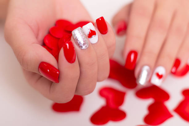 istock Female hands with red manicure nails 1410520519
