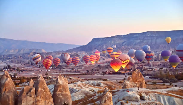 istock Panoramic landscape hot air balloons in Cappadocia, Turkey 1410520612