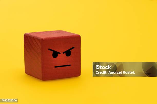 Anger And Frustration Creative Concept Outbursts Of Anger Therapy Helping To Deal With Negative Emotions Red Wooden Block With Painted Human Feelings Yellow Background Empty Space Stock Photo - Download Image Now