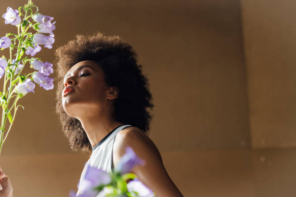 istock A Beautiful Sensual Woman Smelling Canterbury Bells 1410522336
