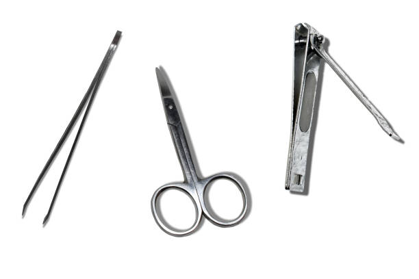 istock Small, grey, hand tool for beauty. Tweezers, nail cutter, scissors isolated on white background 1410523310