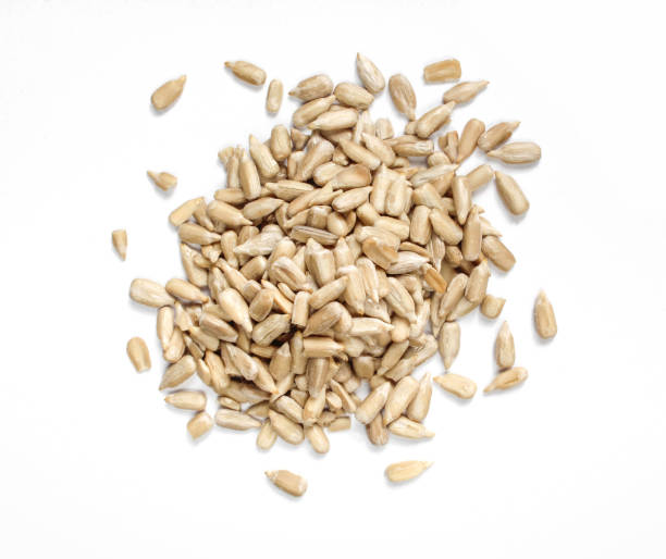 istock Pile of sunflower seeds without shell isolated on white background. 1410524676