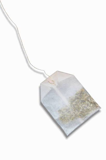 istock Tea bag isolated on white background. Close up of teabag with shadow 1410524873