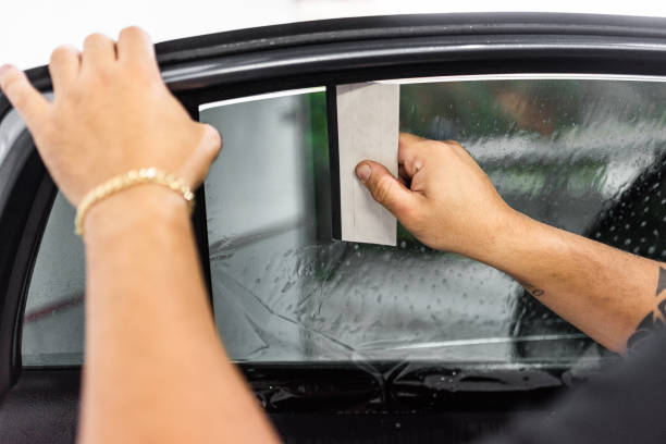 istock Car window film installation service 1410528734