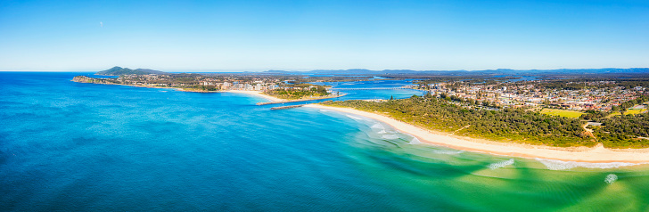 Nine mile beach in Forster Tuncurry towns on Australian Pacific coast around Wallis lake - aerial panorama from sea.