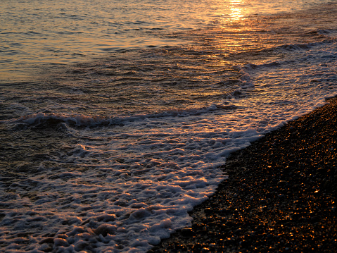 beach and sea waves at sunset