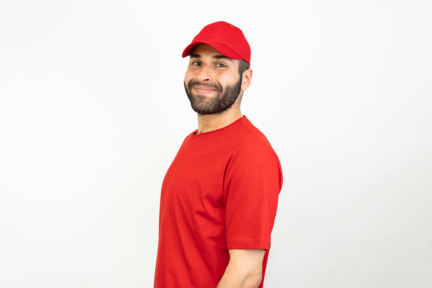 portrait of young middle eastern man wearing hat, isolated white background