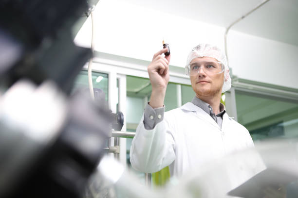 istock scientist  analyzing a biological and ecological hemp plant used for herbal pharmaceutical CBD oil and THC oil in a laboratory. 1410531055