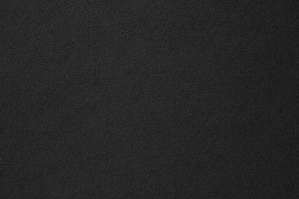istock black paper texture background. gloomy page for text 1410532418