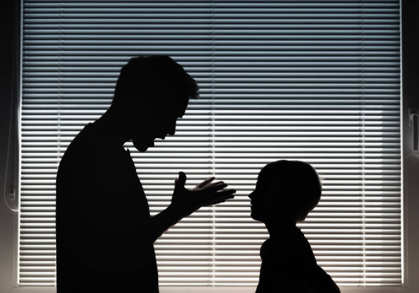 Frustrated, angry father screaming at his child.