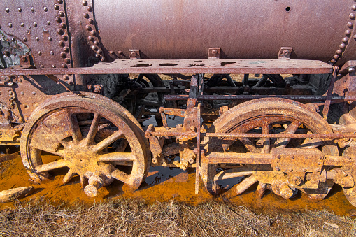 Rusting parts of the “The Last Train to Nowhere” on the Arctic tundra near Safety Sound south of Nome, Alaska. The steamship Aztec delivered three locomotives, track, and railroad ties to the site in 1903, and the Council City & Solomon River railroad was born.  Construction stopped in 1906 after 35 miles of track were laid and the gold ore ran out. The old locomotives and scattered derelict parts are all that remain.