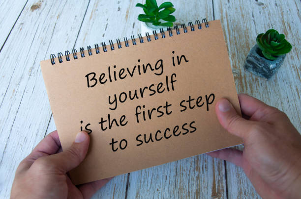 istock Life inspirational quote text on notepad - Believing in yourself is the first step to success. 1410533352