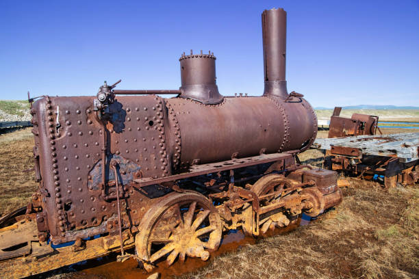 Rusting parts of the “The Last Train to Nowhere” on the Arctic tundra near Safety Sound south of Nome, Alaska. The steamship Aztec delivered three locomotives, track, and railroad ties to the site in 1903, and the Council City & Solomon River railroad was born.  Construction stopped in 1906 after 35 miles of track were laid and the gold ore ran out. The old locomotives and scattered derelict parts are all that remain.