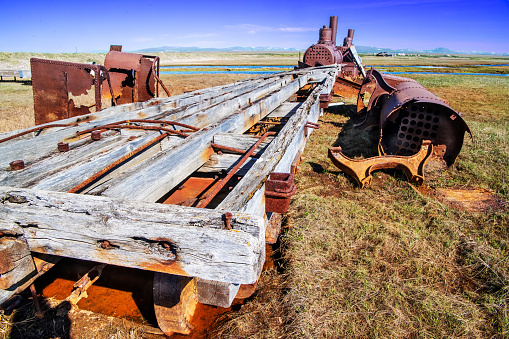 Deteriorating flat bed of one of the old ferries that transported miners and their vehicles across the lagoon to access the Bonanza River near Nome, Alaska.