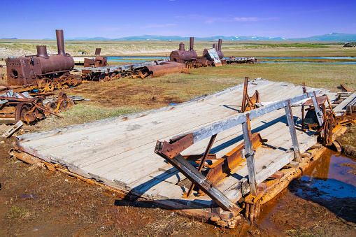Deteriorating flat bed of one of the old ferries that transported miners and their vehicles across the lagoon to access the Bonanza River near Nome, Alaska.