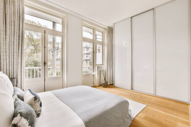 istock A small minimalistic bedroom with a comfortable bed 1410533579