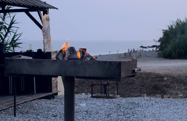 istock Grill on fire next to beach to get the food done 1410534178